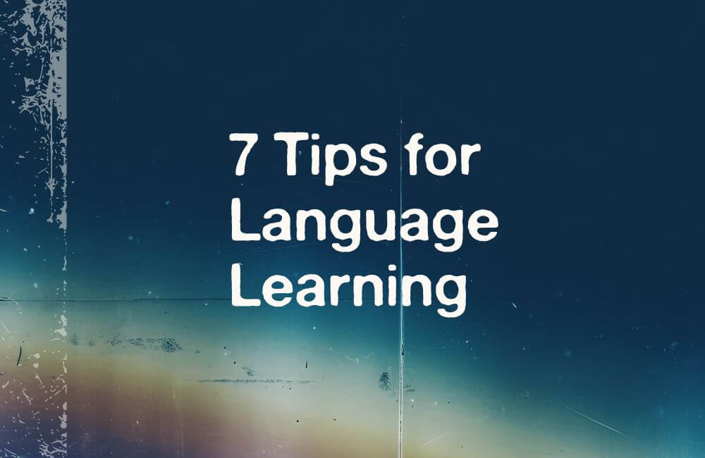 7 Tips for Language Learning blog cover with text and blurred background