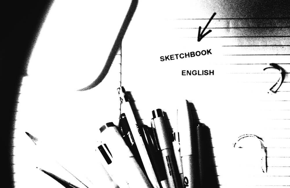 marketing image for sketchbook English course for Creative Careers black and white image of pens and sketchbook