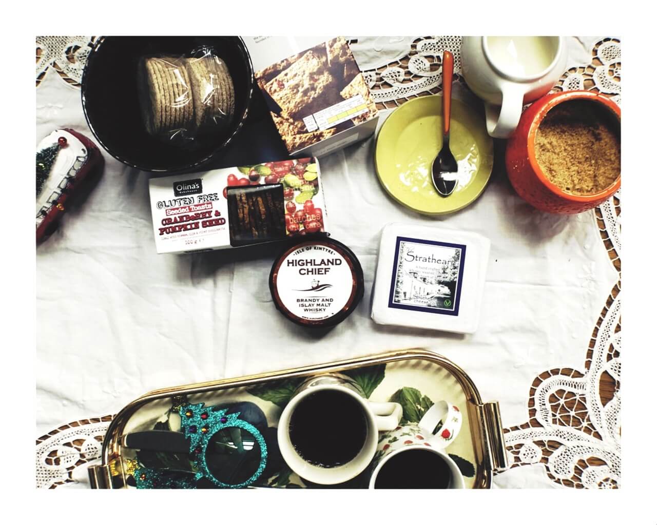 view of table top with food and cheese and Christmas decorations